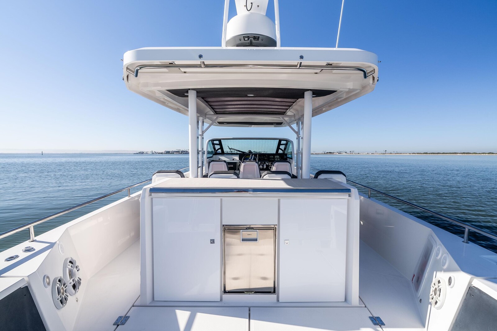 Aft cockpit social area of Axopar 37 Mini Mahana, seating for 10 guests