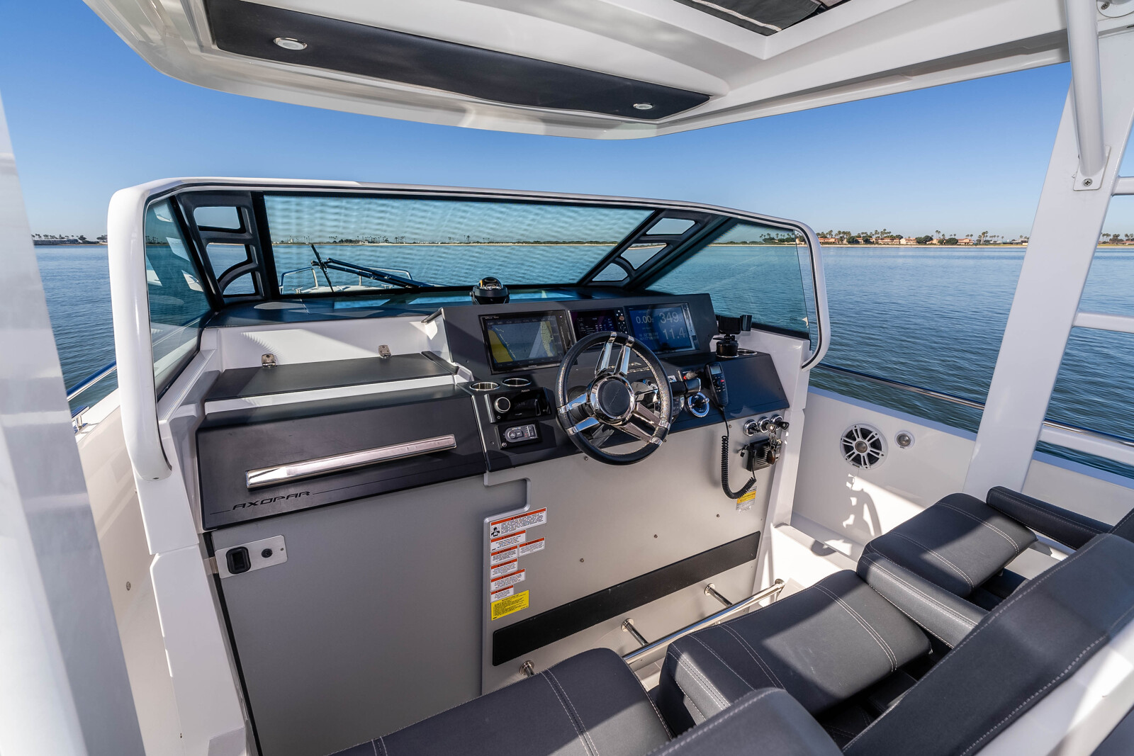 Open cockpit of the Axopar 37 Mini Mahana with retractable canvas roof