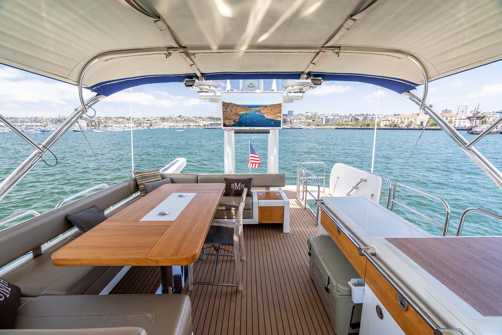 Flybridge of Fairline Squadron 78 Sea Hammock with seating, wet bar and 17-foot RIB davit