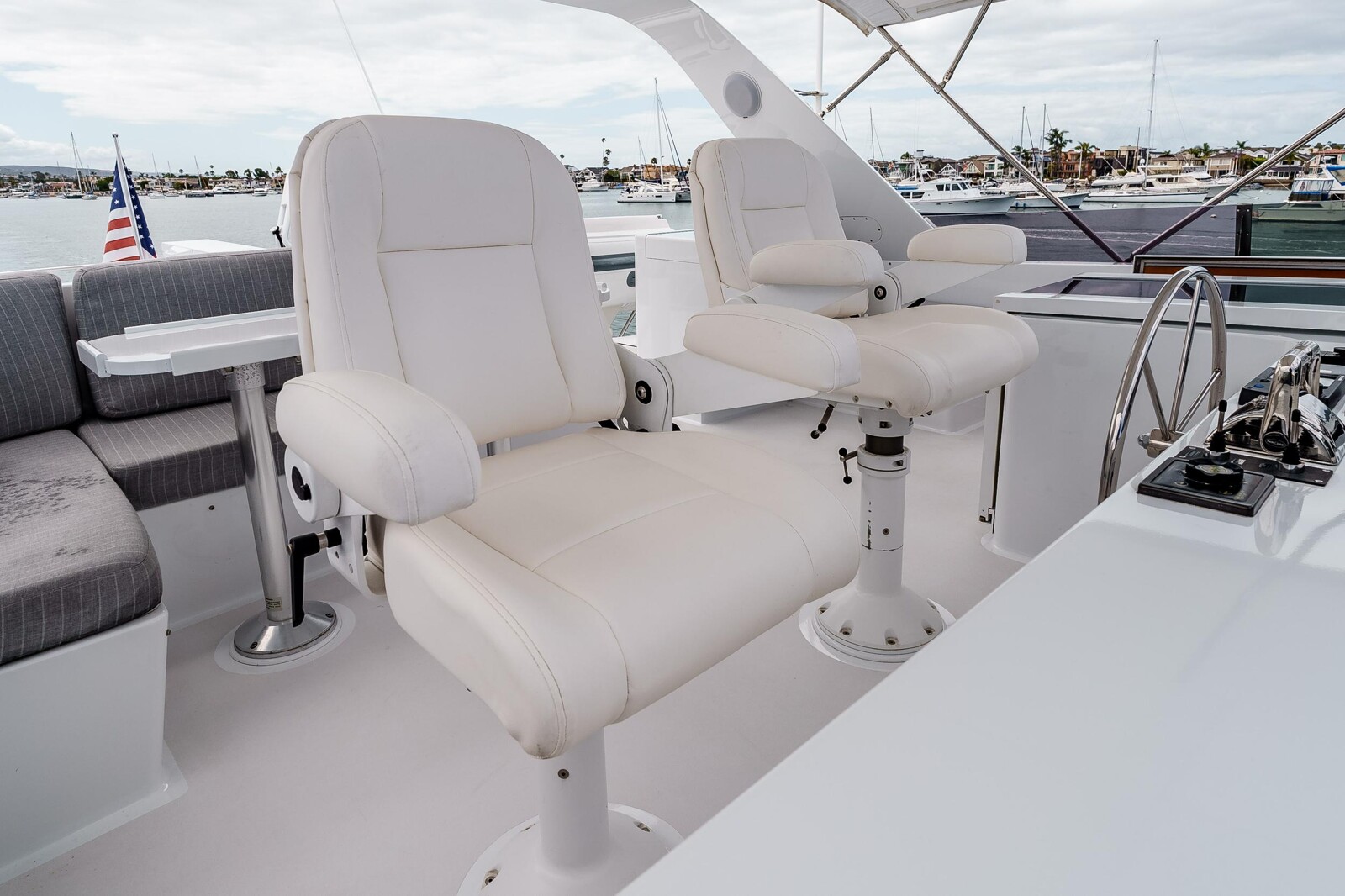 Flybridge helm seating aboard Following Sea II, 74-foot Nordlund motor yacht
